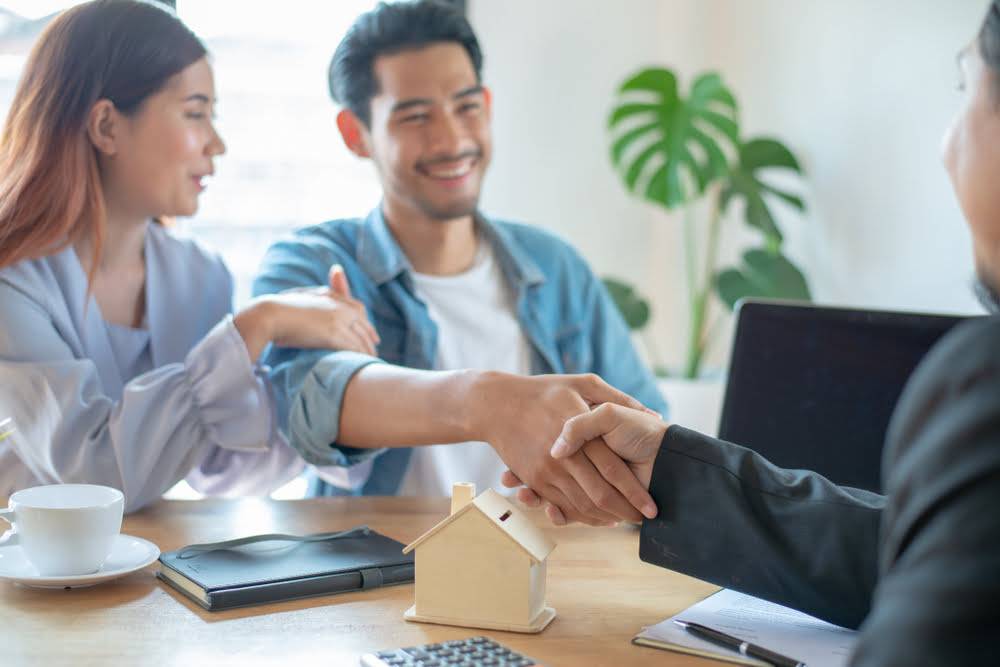 Young,Asian,Couple,Feeling,Happy,After,Finish,Buying,Or,Rental