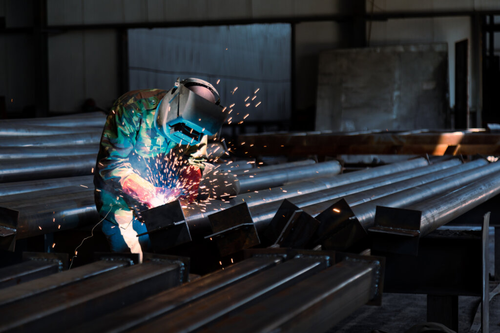 Industrial welder welding metal profiles